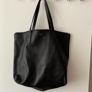 Black leather Cuyana zip top bag